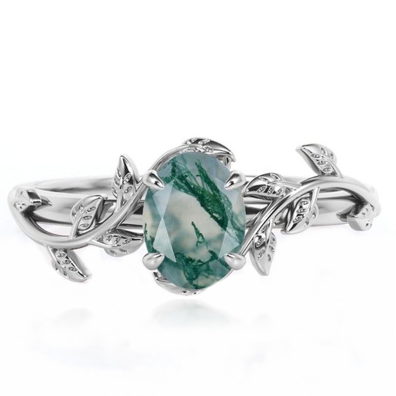 Top view of natural moss agate oval rose cut set in a sterling silver leaf ring