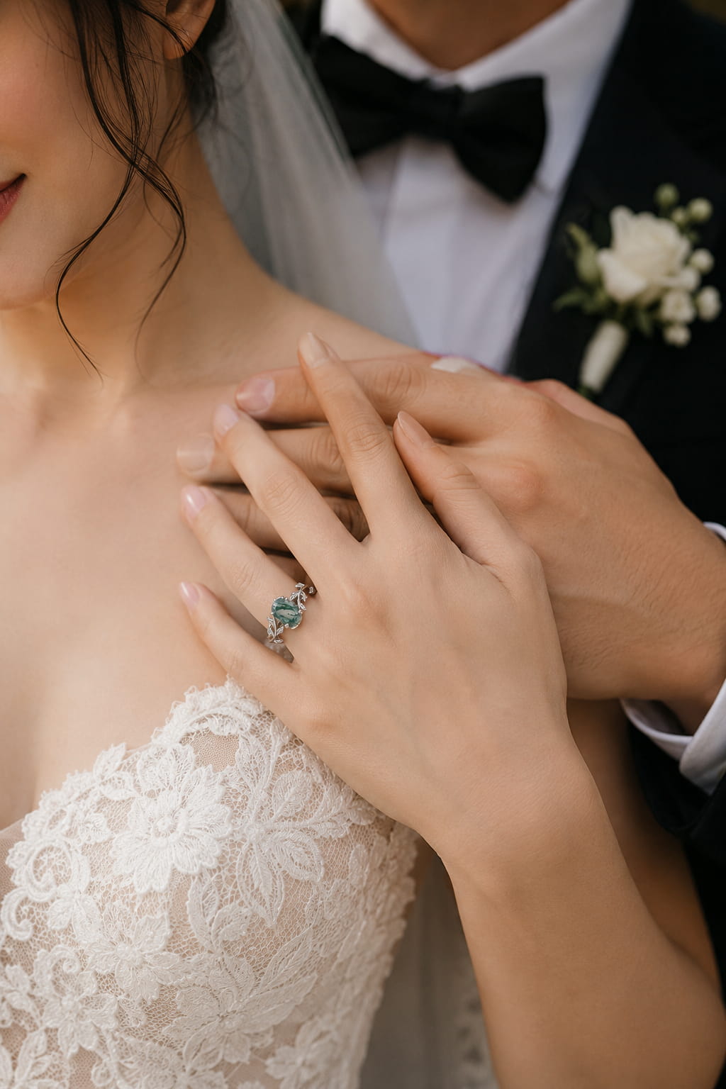 Bride wearing a moss agate engagement ring in 925 sterling silver on her wedding day